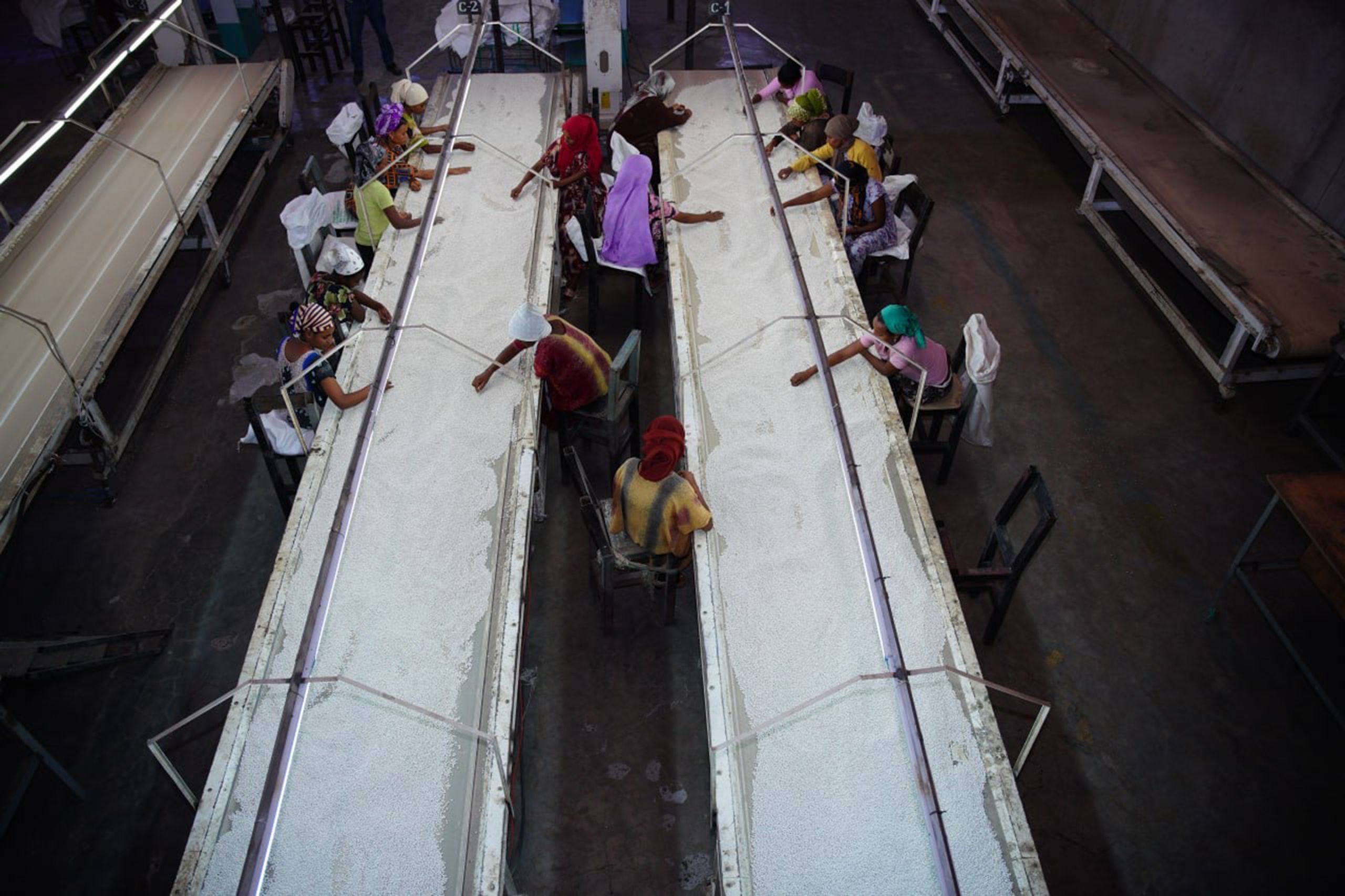 The view looking down on several workers in a production line.
