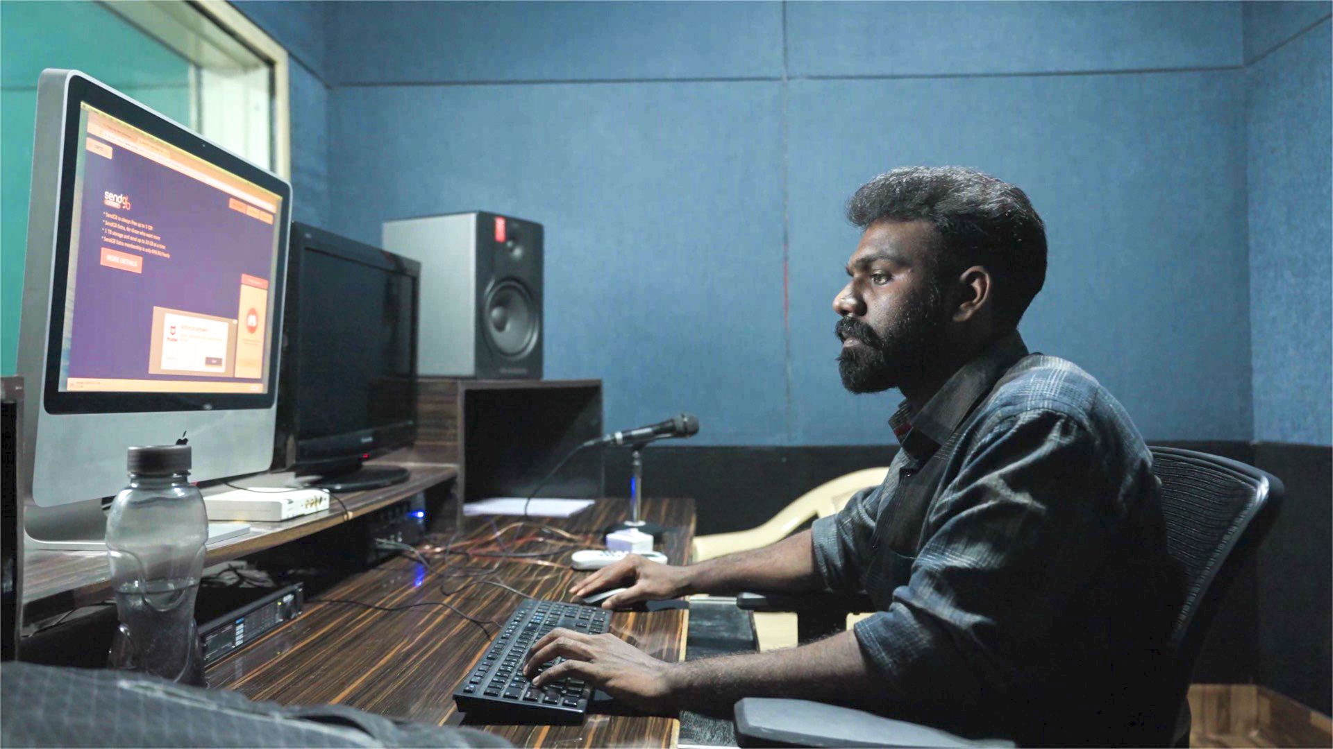 Bhanu Prakash working at his sounds engineer desk.