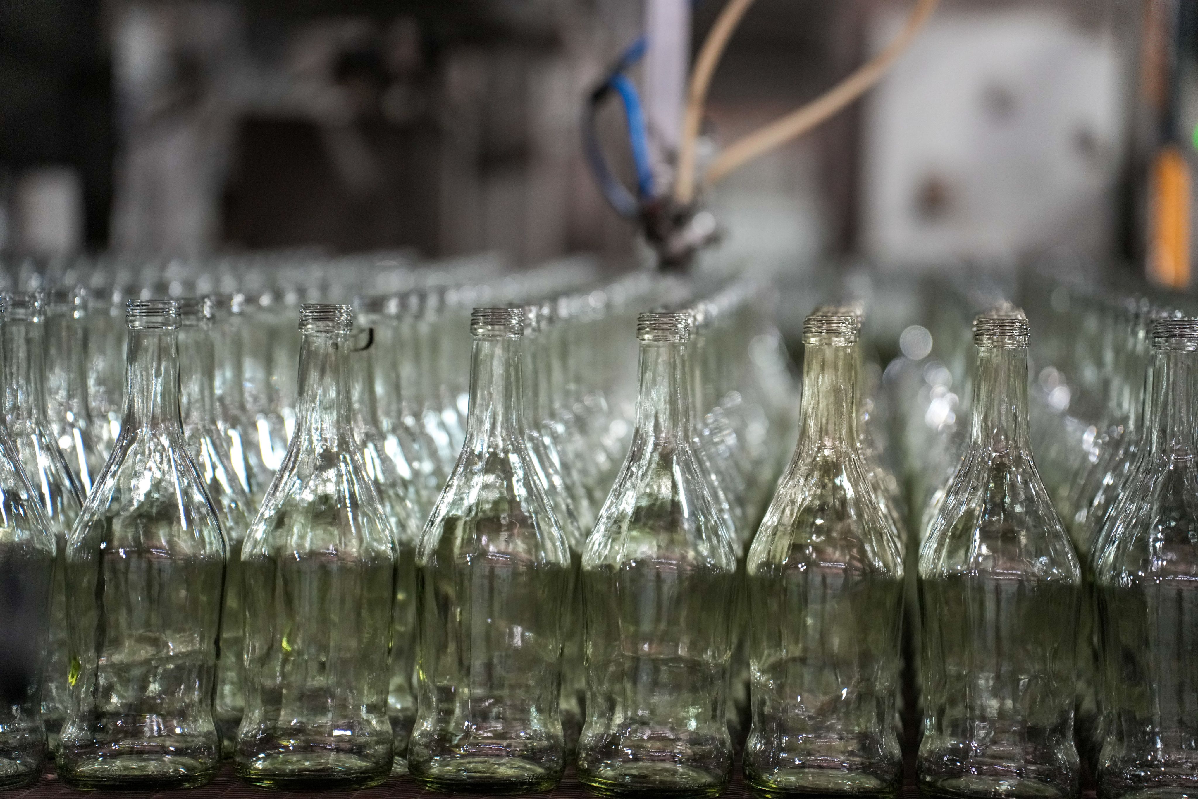 Rows of glass bottles that have been produced in the KIOO plant.