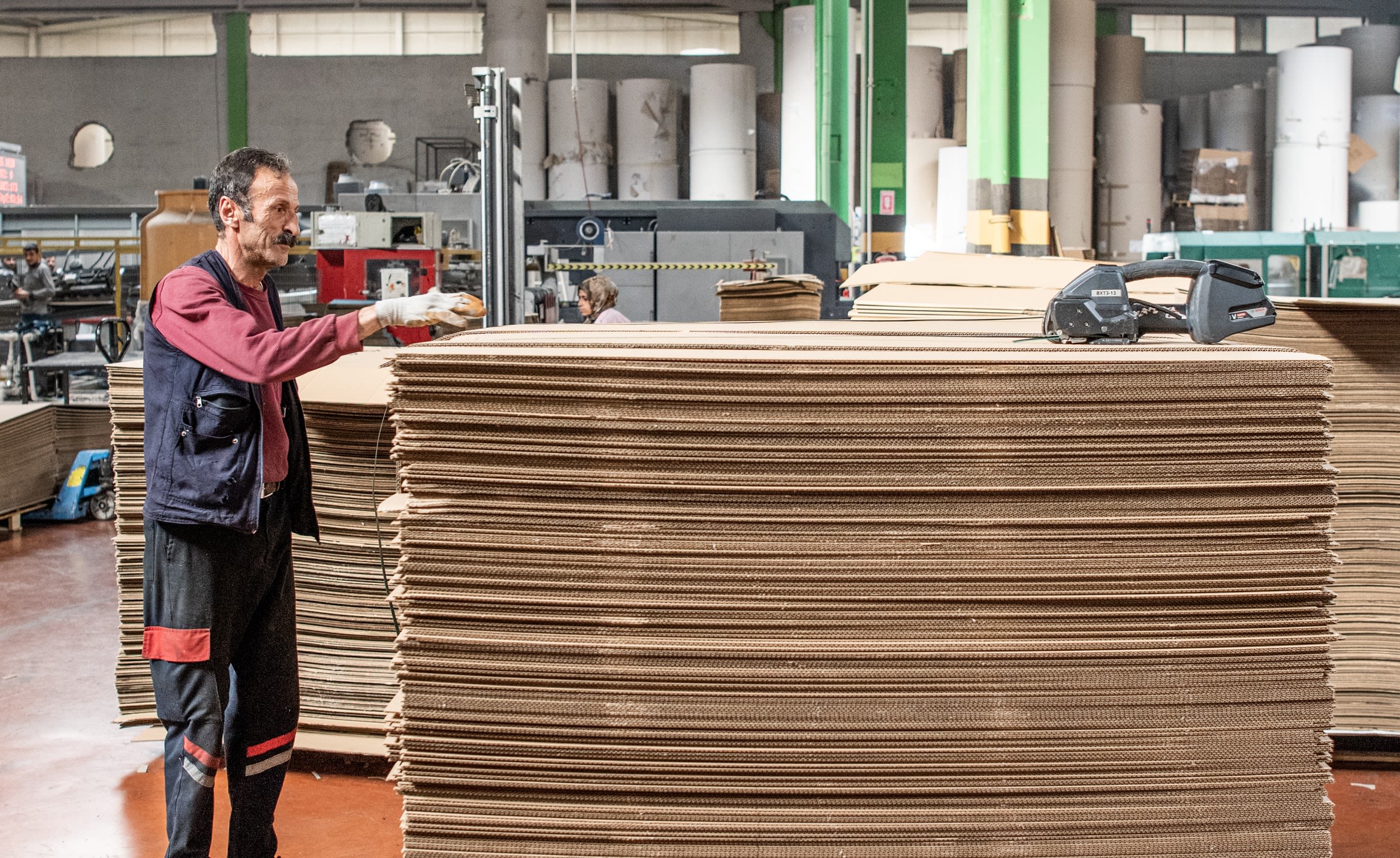 A worker at Atasan Ambalaj, a packaging company, whose printing machines were all compromised during the earthquake