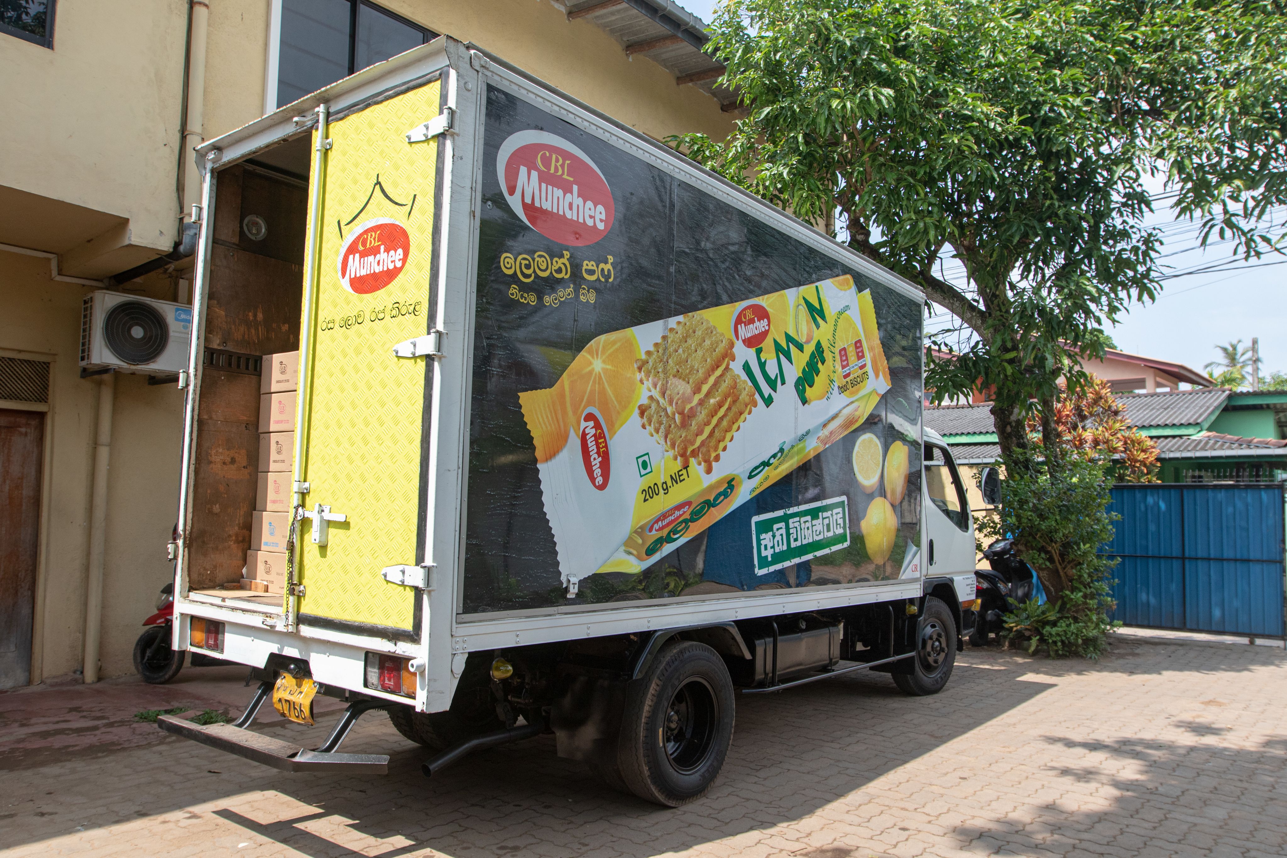A truck that delivers food prepares to leave a warehouse in Sri Lanka.