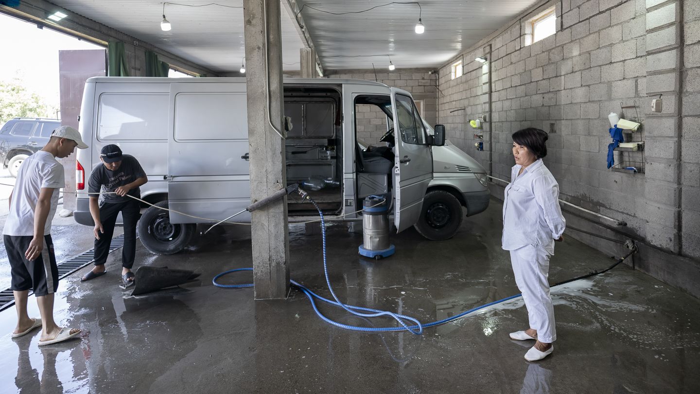 Gulbaira Botaliyeva in her carwash shop. 