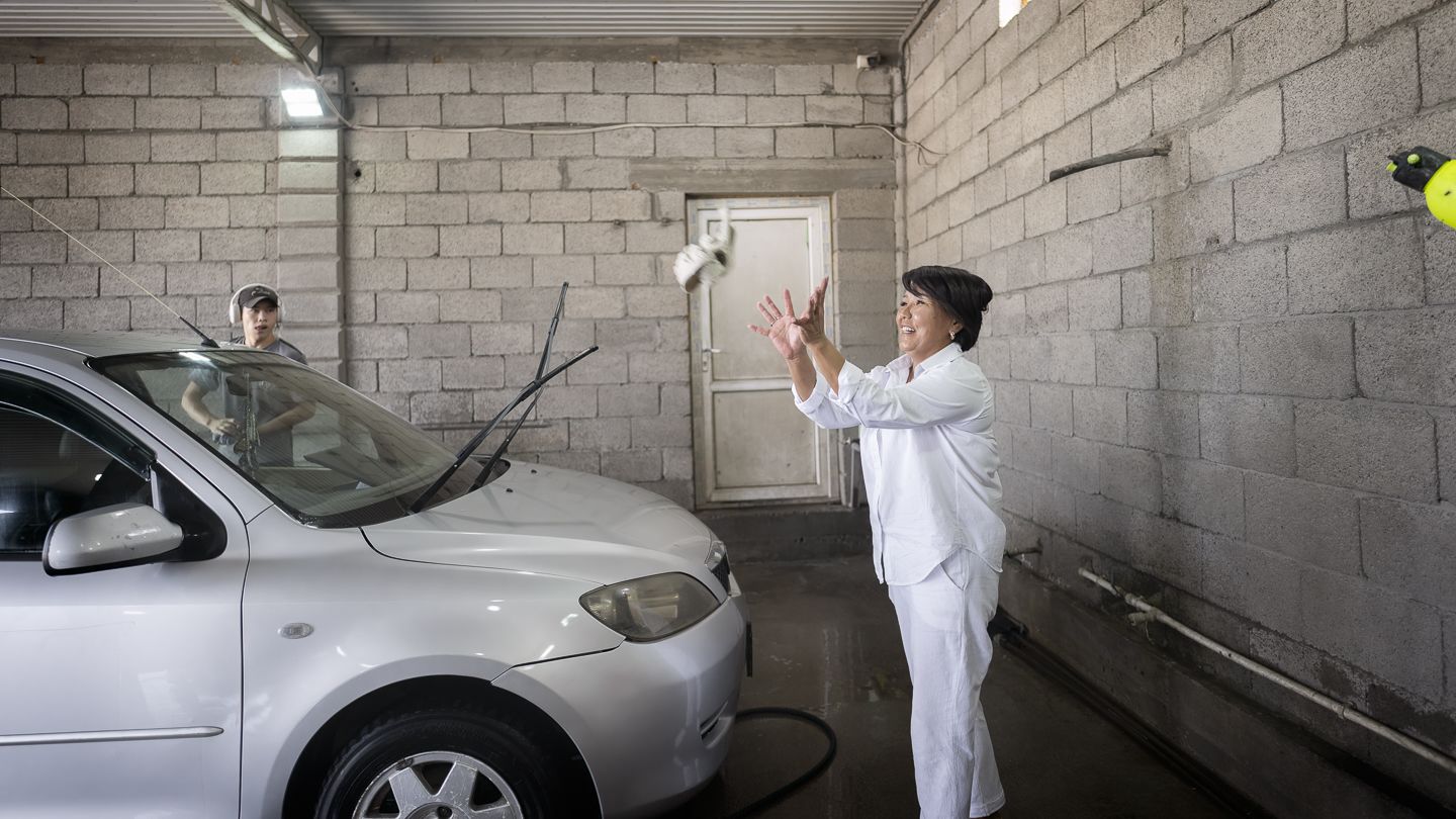 Gulbaira Botaliyeva in her carwash station. 