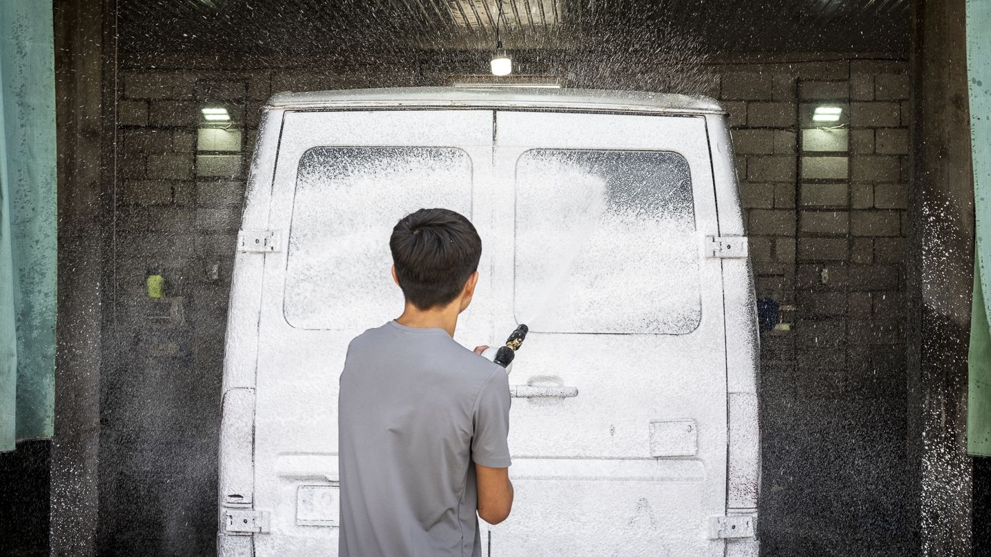 Workers at Gulbaira Botaliyeva's carwash shop.